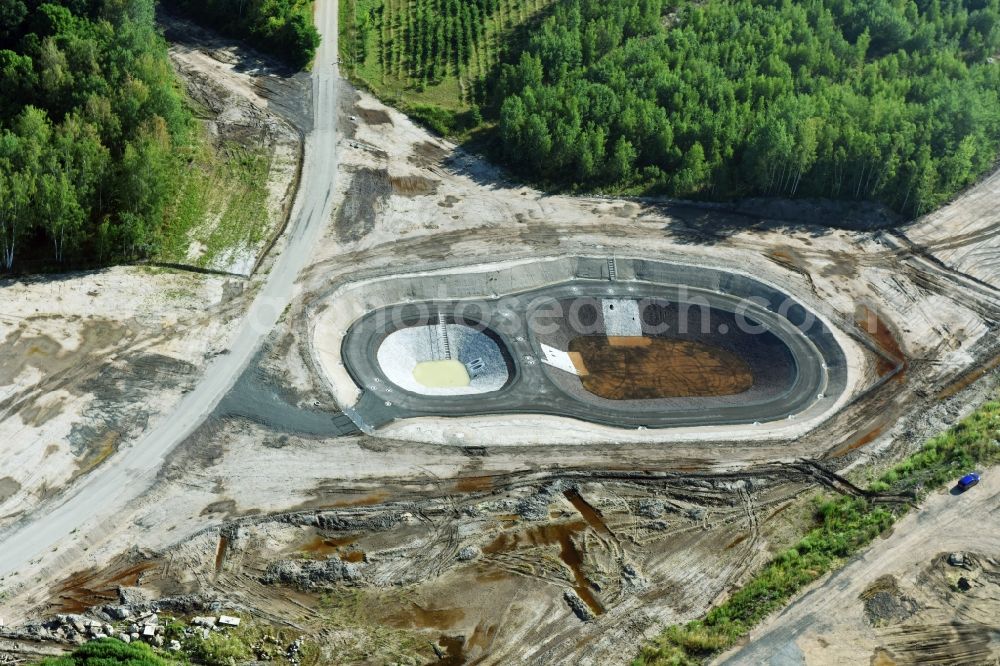 Aerial image Rötha - Rainwater retention basins and fire water pond aloung the Highway- Construction site with earthworks along the route and of the route of the highway route B95 to A72 motorway in Roetha in the state Saxony