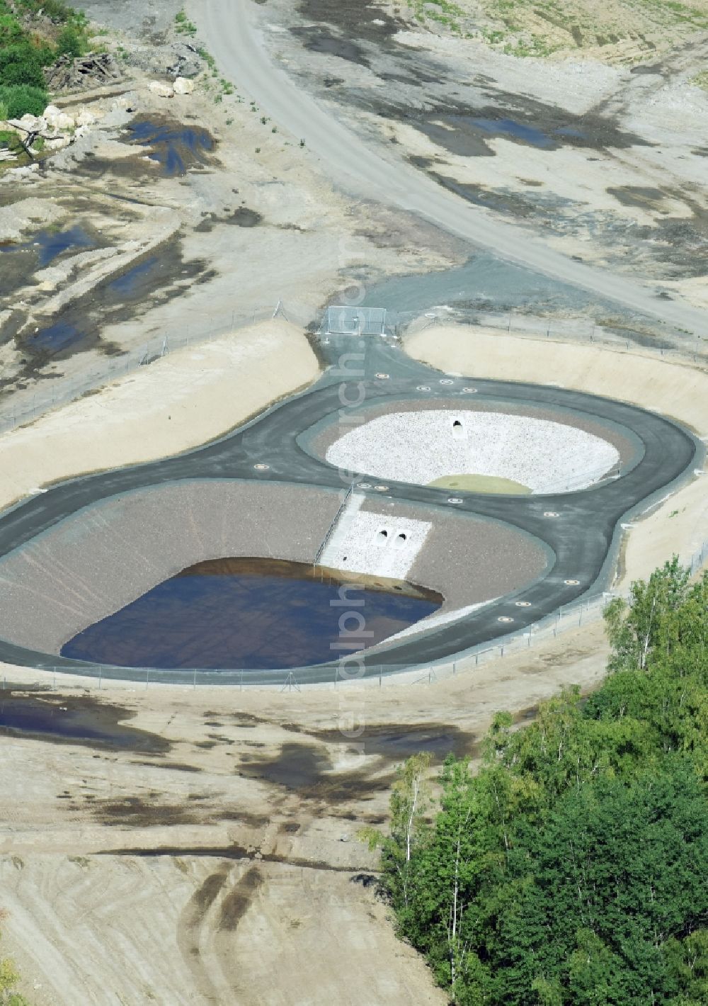 Aerial photograph Rötha - Rainwater retention basins and fire water pond aloung the Highway- Construction site with earthworks along the route and of the route of the highway route B95 to A72 motorway in Roetha in the state Saxony