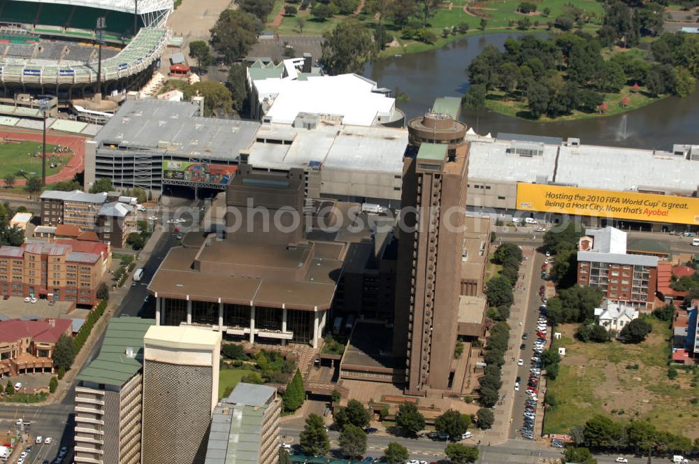 Aerial image BLOEMFONTEIN - Government building of the Free State Provincial Government in Bloemfontein, South Africa. Behind the building lies Loch Logan with the Loch Logan Waterfront shopping mall at its shores. In the left-hand corner is the Free State Stadium, one of the venues of the soccer world cup 2010