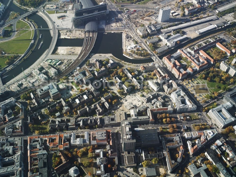 Berlin from the bird's eye view: View of the Berlin Central Station on the river Spree in the Moabit part of Berlin. The glas roof is an important landmark of the capital and covers the most important train station of the city. The building was designed by Meinhard von Gerkan