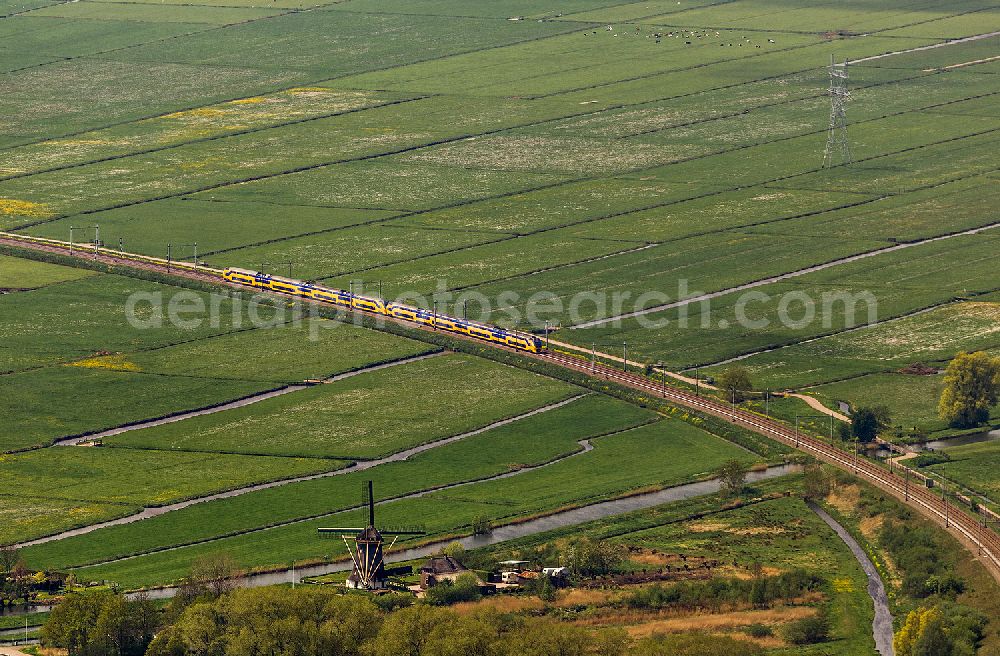 Naarden from the bird's eye view: View the train track in the fields and irrigation ditches of Naarden in North Holland - Netherlands