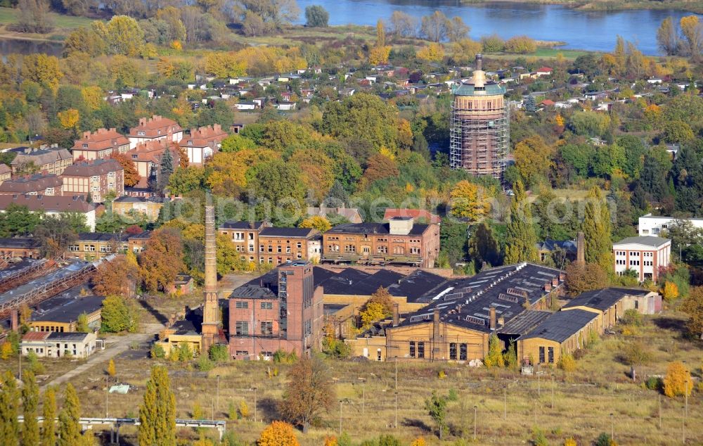 Magdeburg from above - Blick auf das Reichsbahnausbesserungswerk RAW Salbke in Magdeburg im Bundesland Sachsen-Anhalt. Das RAW Salbke war ein Ausbesserungswerk der Deutschen Reichsbahn im Magdeburger Stadtteil Salbke. Teile der Anlage stehen unter Denkmalschutz. Im Hintergrund ist der sich im Bau befindliche Salbker Wasserturm zu erkennen.// View of the German State Railways Ausbesserungswerk Salbke in Magdeburg in the state Saxony-Anhalt. The RAW Salbke has been a repairation factory of the German State Railways in the district Salbke of Magdeburg. In the background is the water tower, which is in reparation.