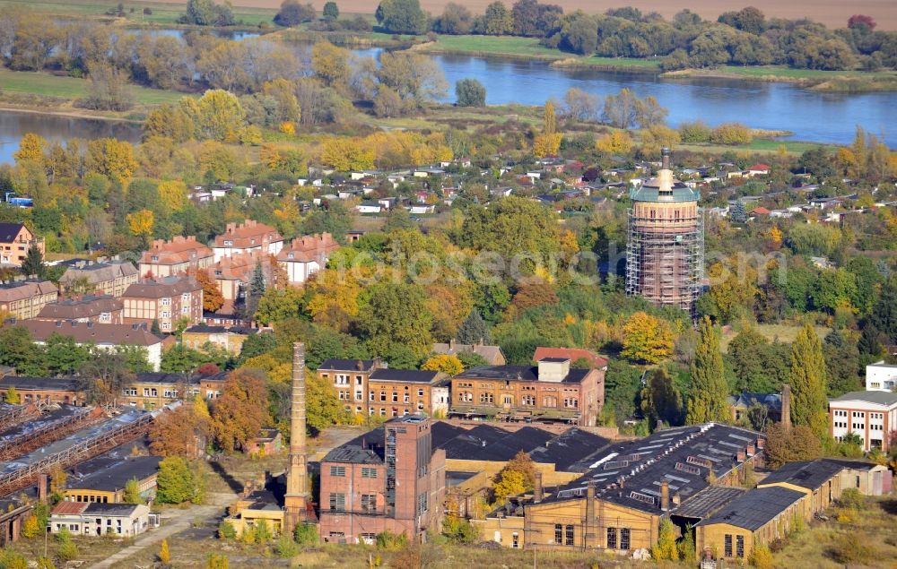 Magdeburg from the bird's eye view: Blick auf das Reichsbahnausbesserungswerk RAW Salbke in Magdeburg im Bundesland Sachsen-Anhalt. Das RAW Salbke war ein Ausbesserungswerk der Deutschen Reichsbahn im Magdeburger Stadtteil Salbke. Teile der Anlage stehen unter Denkmalschutz. Im Hintergrund ist der sich im Bau befindliche Salbker Wasserturm zu erkennen.// View of the German State Railways Ausbesserungswerk Salbke in Magdeburg in the state Saxony-Anhalt. The RAW Salbke has been a repairation factory of the German State Railways in the district Salbke of Magdeburg. In the background is the water tower, which is in reparation.