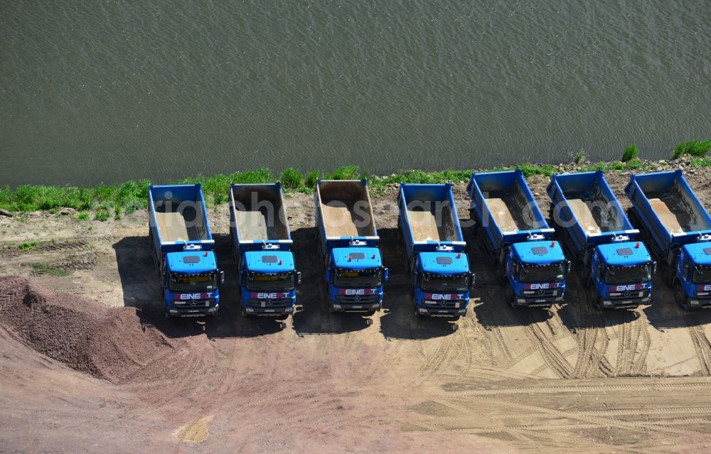 Aerial photograph Ihleburg - Series of Mercedes trucks of REINERT Logistic GmbH & Co. KG at a construction site on the banks of the Elbe-Havel Canal at Ihleburg in Saxony-Anhalt