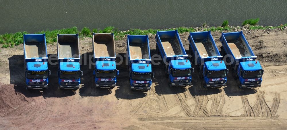 Ihleburg from above - Series of Mercedes trucks of REINERT Logistic GmbH & Co. KG at a construction site on the banks of the Elbe-Havel Canal at Ihleburg in Saxony-Anhalt