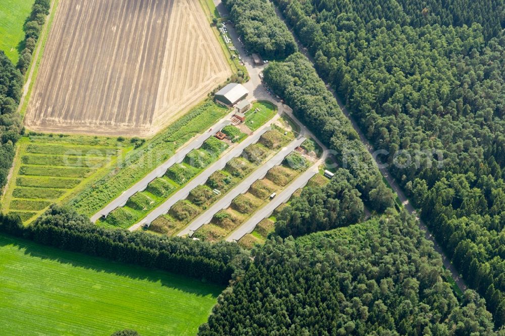 Deinste from the bird's eye view: Panel rows of photovoltaic and solar farm or solar power plant in Deinste in the state Lower Saxony, Germany