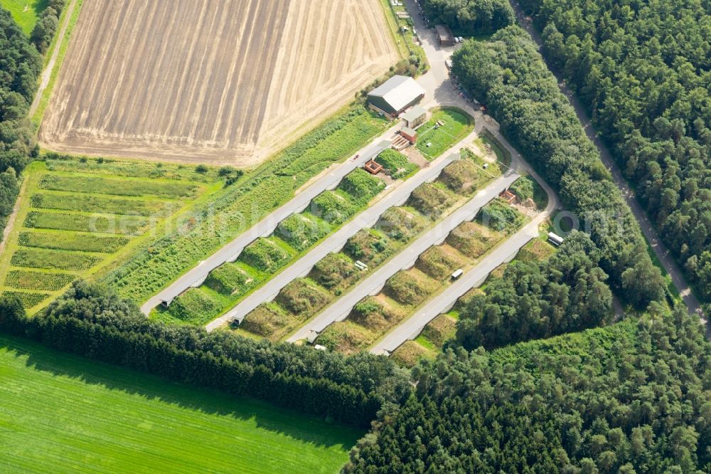 Aerial image Deinste - Panel rows of photovoltaic and solar farm or solar power plant in Deinste in the state Lower Saxony, Germany