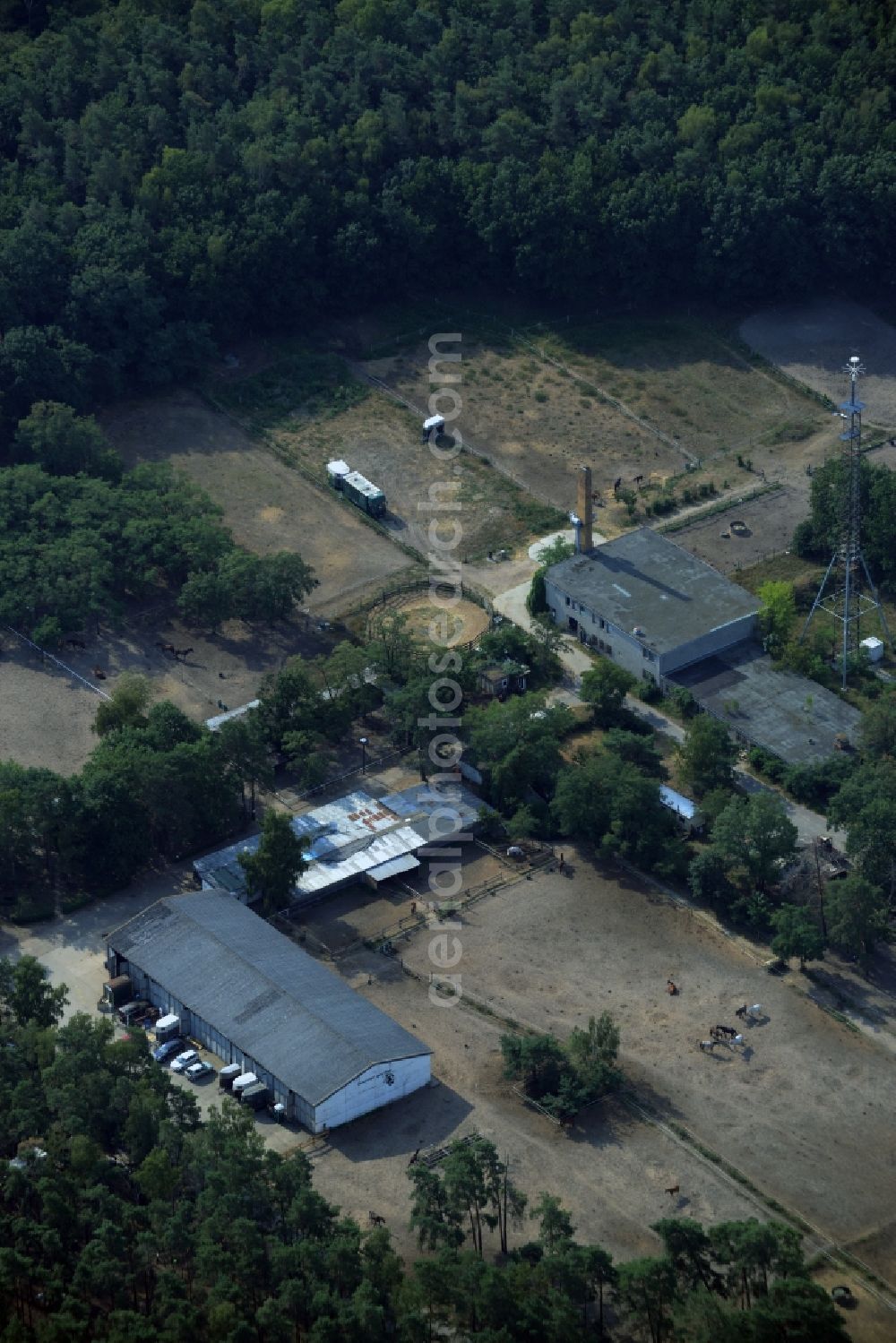 Berlin from above - Building of stables of the Reitstall Lyck-Piehl in the Mahlsdorf part of Berlin in Germany. The compound is located on the edge of Berlin in a forest at the border with Hoppegarten