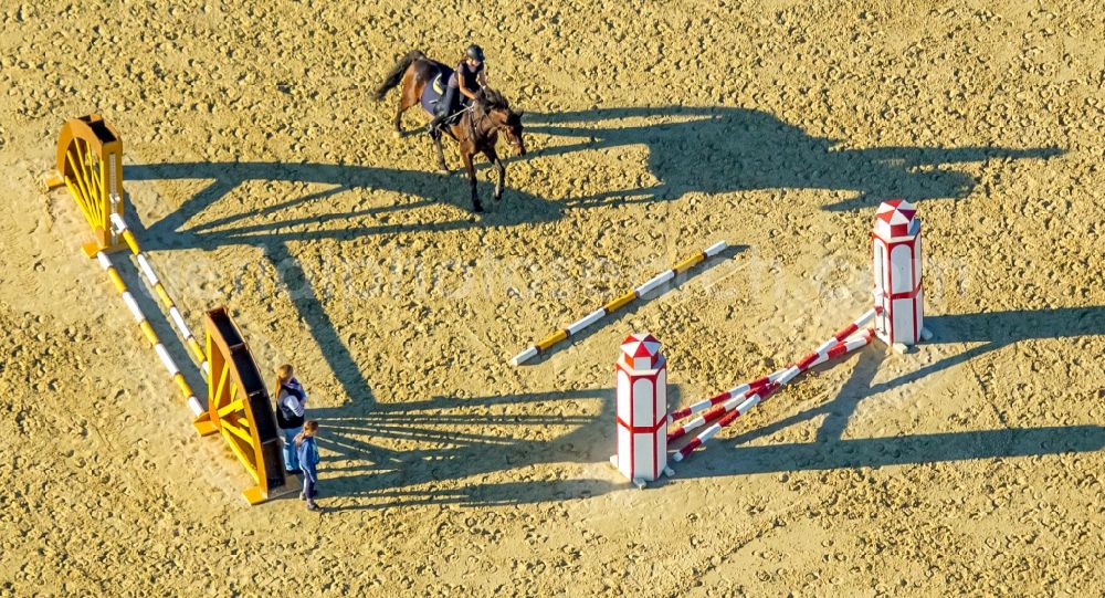 Hamm from above - Building of stables with obstacle training with long shadows at the riding Rhynern in Hamm in the state North Rhine-Westphalia