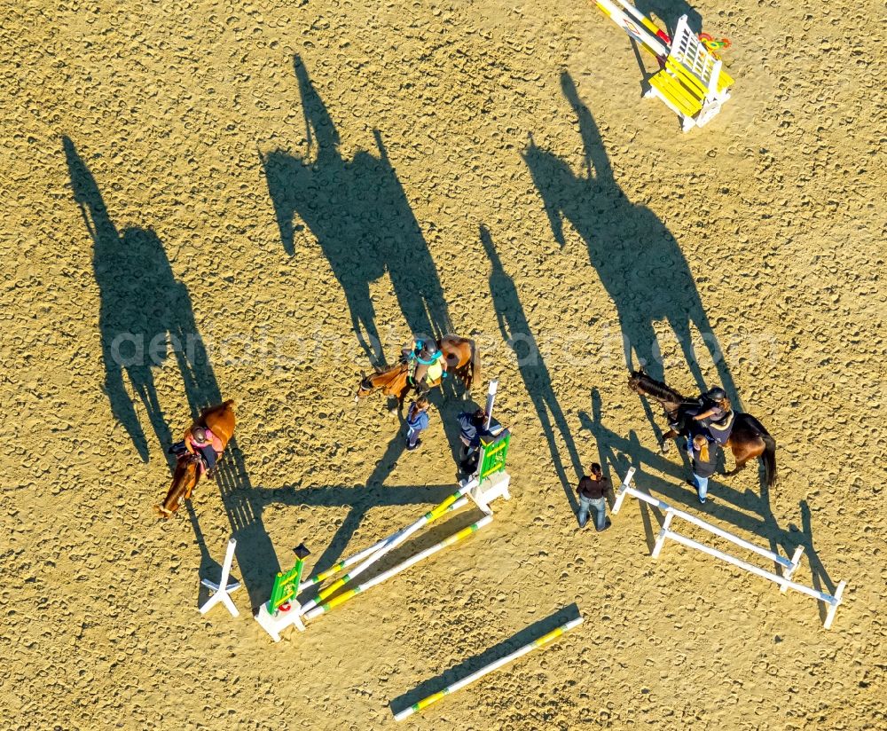 Hamm from the bird's eye view: Building of stables with obstacle training with long shadows at the riding Rhynern in Hamm in the state North Rhine-Westphalia