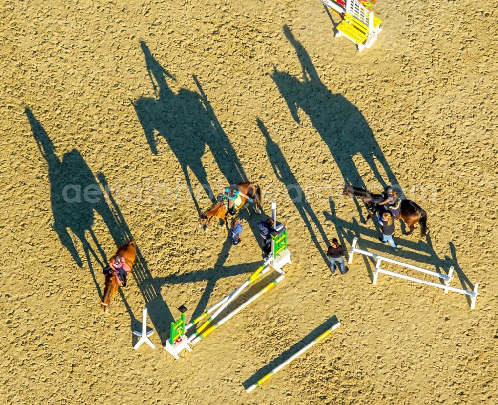 Hamm from above - Building of stables with obstacle training with long shadows at the riding Rhynern in Hamm in the state North Rhine-Westphalia