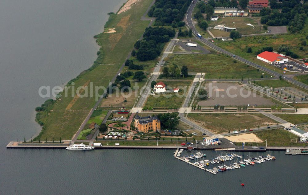 Aerial image Bitterfeld - Blick auf die Rekultivierungsfläche am Bernsteinsee in Bitterfeld.Das Gelände an der B100 in Richtung Goitzsche wird geschückt durch ein Anwesen, das den phantasievollen Namen „Villa am Bernsteinsee“ trägt. Die ehemals „Biermannsche Villa“ wurde 1896 im prunkvollen Stil der Neorenaissance errichtet. View of the reclamation area on Bernsteinsee in Bitterfeld.