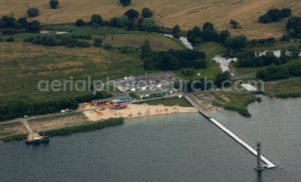 Bitterfeld from above - Blick auf die Rekultivierungsfläche am Bernsteinsee in Bitterfeld.Das Gelände an der B100 in Richtung Goitzsche wird geschückt durch ein Anwesen, das den phantasievollen Namen „Villa am Bernsteinsee“ trägt. Die ehemals „Biermannsche Villa“ wurde 1896 im prunkvollen Stil der Neorenaissance errichtet. View of the reclamation area on Bernsteinsee in Bitterfeld.