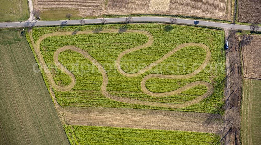 Aerial photograph Werl - Track on a motor-cross terrain on a harvested field at Werl in the state of North Rhine-Westphalia