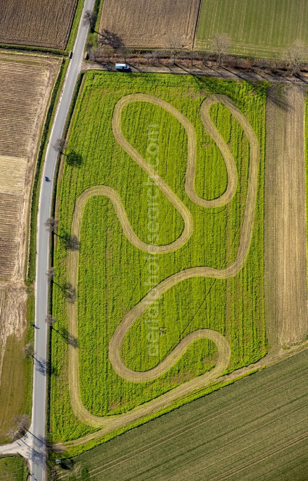 Werl from above - Track on a motor-cross terrain on a harvested field at Werl in the state of North Rhine-Westphalia