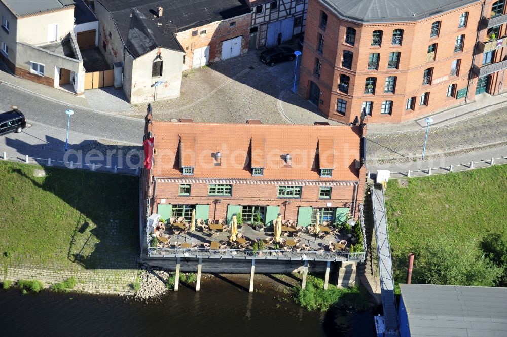 Aerial photograph Wittenberge - 07/08/2012 Wittenberge View the Crane House restaurant on the banks of the Elbe in Wittenberg in the state of Brandenburg. The old warehouse is made ??after extensive restoration and renovation zeitgerechtem an attraction for tourism in the region