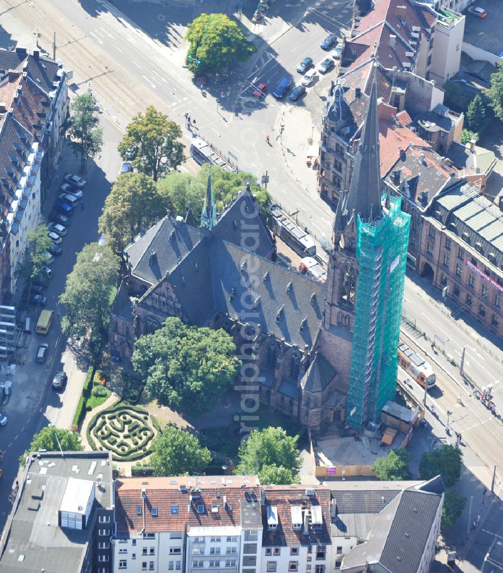 Saarbrücken from above - Restaurierungsarbeiten am Turm der evangelischen Johanneskirche in Saarbrücken im Saarland. Die neugotische Kirche wurde um 1895 vom Architekten Heinrich Güth erbaut. Sie steht im Saarbrückener Stadtteil St. Johann, gegenüber dem Rathausplatz. Renovation works on evangelical church Johanneskirche in city Saarbrücken in Saarland. The neo-Gothic church was built around 1895 by architect Heinrich Güth. It is located in district St. Johann, in opposition to the townhall square.