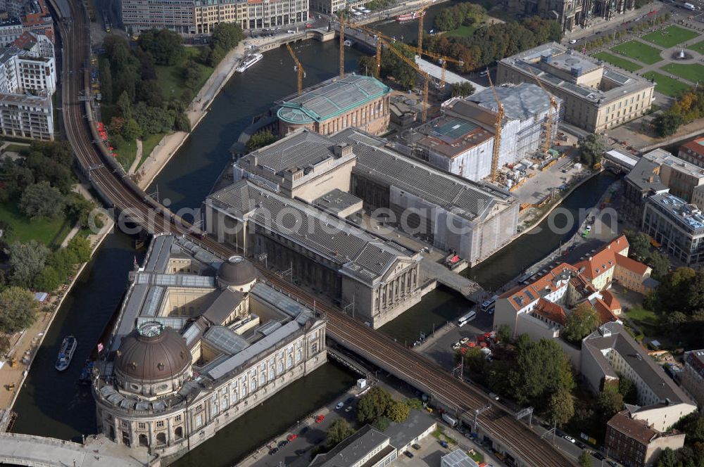 Berlin from above - Berlin's Museum Island is shaped by decades of construction and reconstruction works in the city center. It is the nucleus of the Berlin museum landscape and with its Museums today a much visited tourist point of contact and one of the most important museum complexes in the world. Since 1999, the Museum Island to the world's unique cultural and architectural ensemble of the World Heritage Site