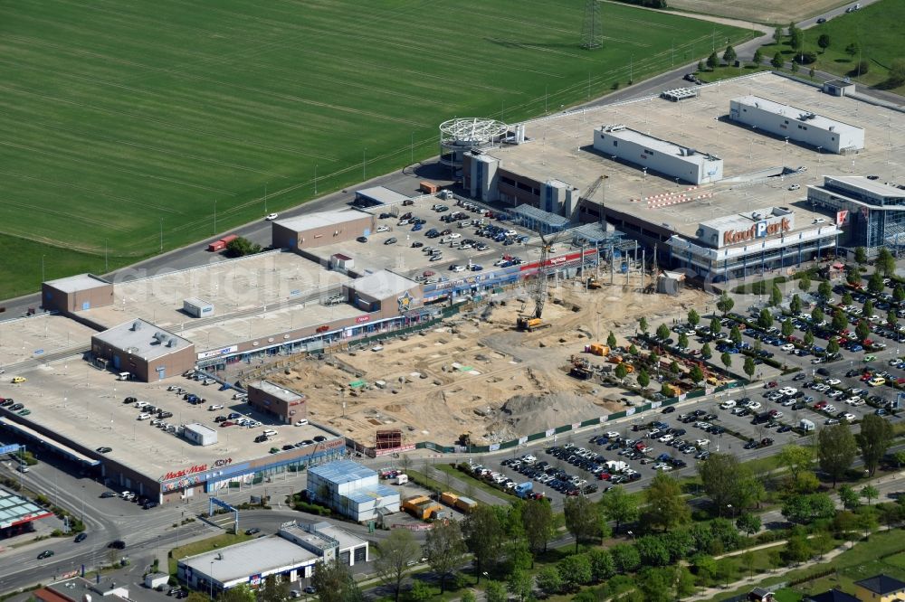 Ahrensfelde from the bird's eye view: Revitalization and expansion construction at the building complex of the shopping center KaufPark Eiche der Unibail-Rodamco Germany GmbH in Ahrensfelde in the state Brandenburg