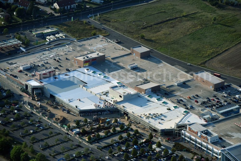 Ahrensfelde from the bird's eye view: Revitalization and expansion construction at the building complex of the shopping center KaufPark Eiche der Unibail-Rodamco Germany GmbH in Ahrensfelde in the state Brandenburg