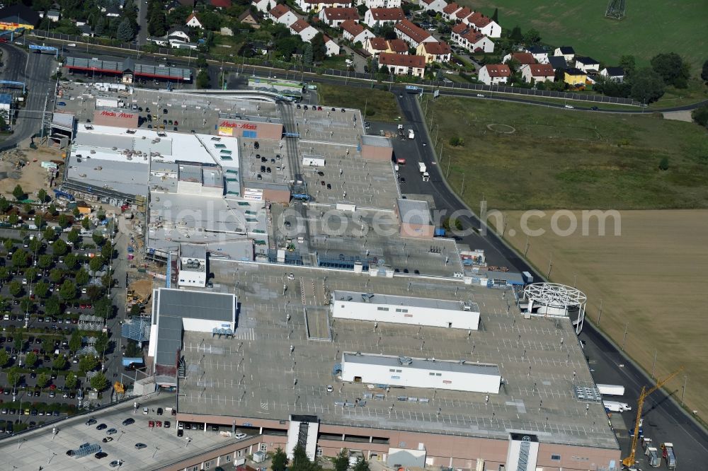 Ahrensfelde from above - Revitalization and expansion construction at the building complex of the shopping center KaufPark Eiche der Unibail-Rodamco Germany GmbH in Ahrensfelde in the state Brandenburg