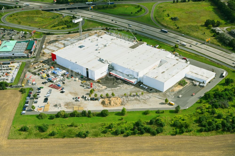 Aerial photograph Fredersdorf-Vogelsdorf - Revitalization and expansion construction site at the building complex Moebel Hoeffner as part of the shopping center Multicenter Vogelsdorf on Frankfurter Chaussee in Fredersdorf-Vogelsdorf in the federal state of Brandenburg, Germany