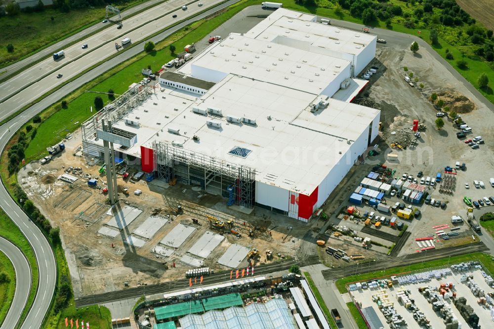 Aerial photograph Fredersdorf-Vogelsdorf - Revitalization and expansion construction site at the building complex Moebel Hoeffner as part of the shopping center Multicenter Vogelsdorf on Frankfurter Chaussee in Fredersdorf-Vogelsdorf in the federal state of Brandenburg, Germany