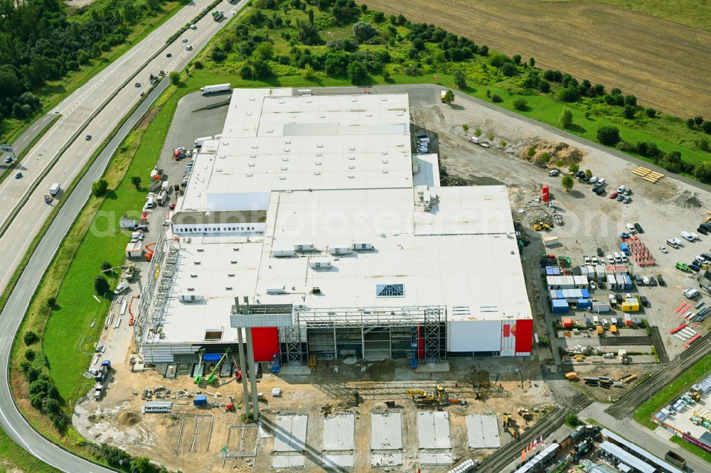 Fredersdorf-Vogelsdorf from above - Revitalization and expansion construction site at the building complex Moebel Hoeffner as part of the shopping center Multicenter Vogelsdorf on Frankfurter Chaussee in Fredersdorf-Vogelsdorf in the federal state of Brandenburg, Germany