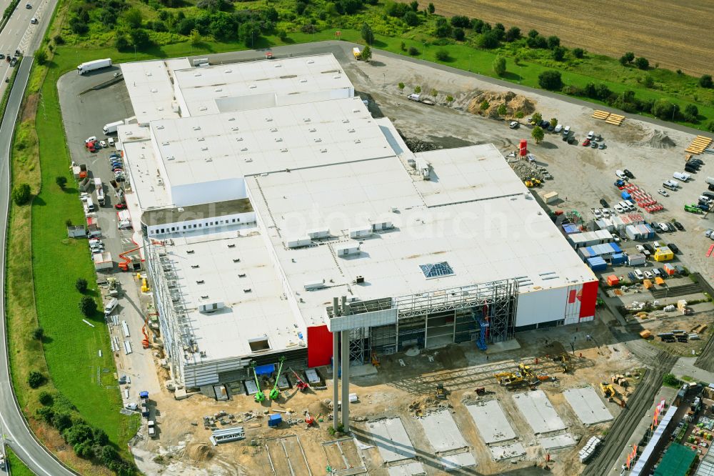 Fredersdorf-Vogelsdorf from the bird's eye view: Revitalization and expansion construction site at the building complex Moebel Hoeffner as part of the shopping center Multicenter Vogelsdorf on Frankfurter Chaussee in Fredersdorf-Vogelsdorf in the federal state of Brandenburg, Germany