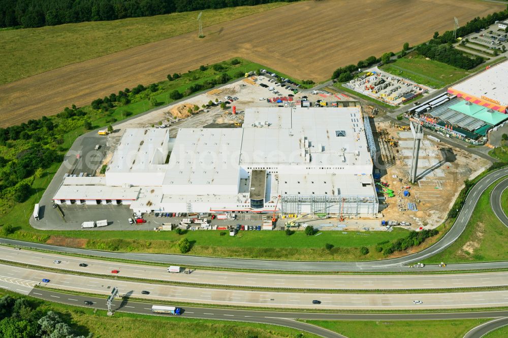 Fredersdorf-Vogelsdorf from above - Revitalization and expansion construction site at the building complex Moebel Hoeffner as part of the shopping center Multicenter Vogelsdorf on Frankfurter Chaussee in Fredersdorf-Vogelsdorf in the federal state of Brandenburg, Germany