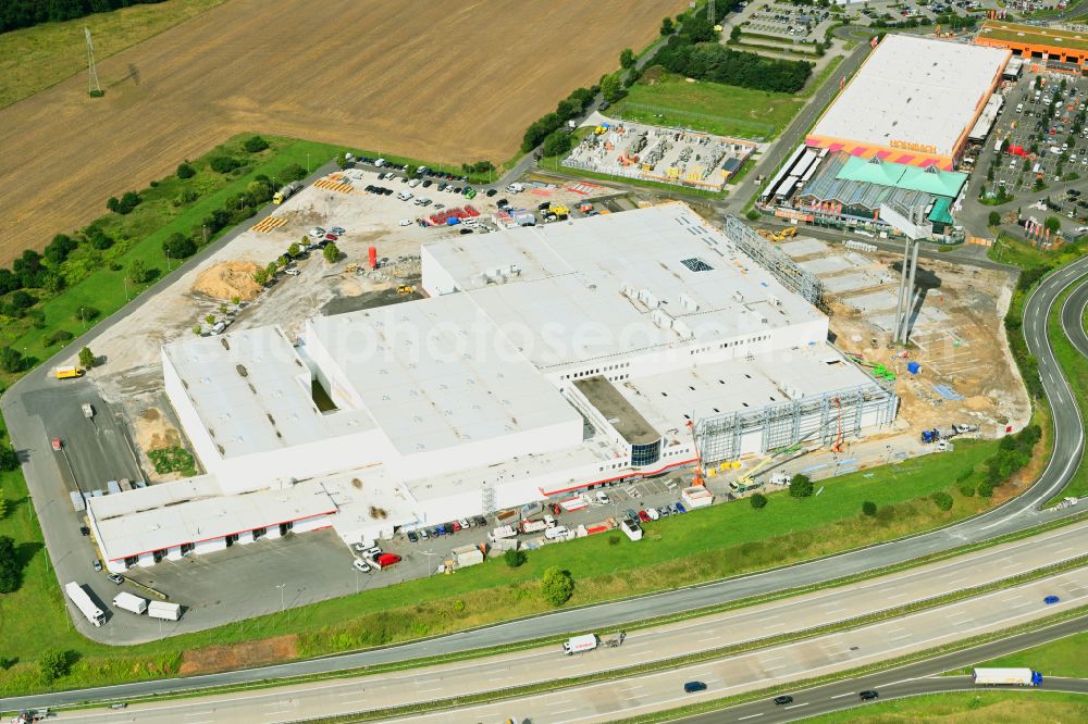 Fredersdorf-Vogelsdorf from the bird's eye view: Revitalization and expansion construction site at the building complex Moebel Hoeffner as part of the shopping center Multicenter Vogelsdorf on Frankfurter Chaussee in Fredersdorf-Vogelsdorf in the federal state of Brandenburg, Germany