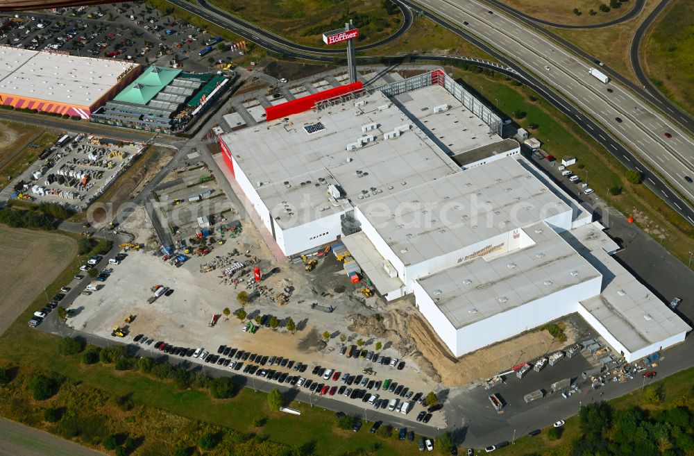 Aerial image Fredersdorf-Vogelsdorf - Revitalization and expansion construction site at the building complex Moebel Hoeffner as part of the shopping center Multicenter Vogelsdorf on Frankfurter Chaussee in Fredersdorf-Vogelsdorf in the federal state of Brandenburg, Germany