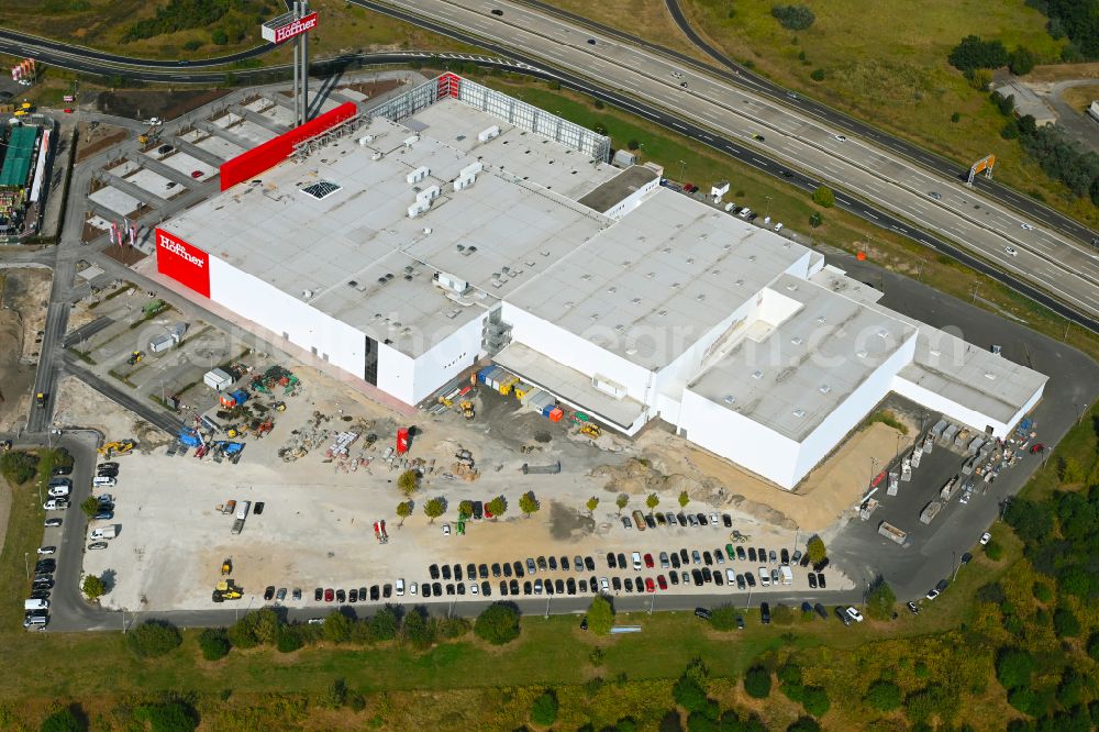 Aerial photograph Fredersdorf-Vogelsdorf - Revitalization and expansion construction site at the building complex Moebel Hoeffner as part of the shopping center Multicenter Vogelsdorf on Frankfurter Chaussee in Fredersdorf-Vogelsdorf in the federal state of Brandenburg, Germany