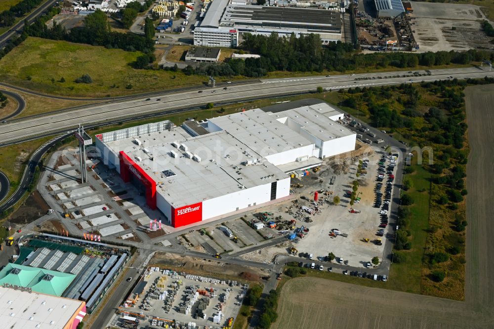 Fredersdorf-Vogelsdorf from the bird's eye view: Revitalization and expansion construction site at the building complex Moebel Hoeffner as part of the shopping center Multicenter Vogelsdorf on Frankfurter Chaussee in Fredersdorf-Vogelsdorf in the federal state of Brandenburg, Germany