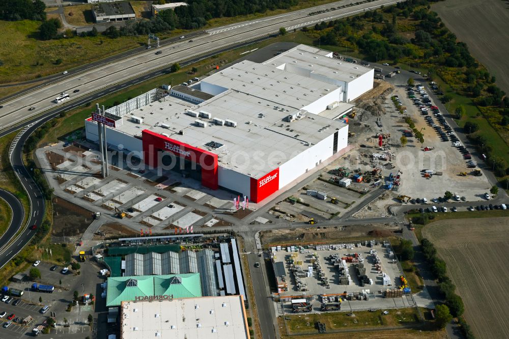 Aerial image Fredersdorf-Vogelsdorf - Revitalization and expansion construction site at the building complex Moebel Hoeffner as part of the shopping center Multicenter Vogelsdorf on Frankfurter Chaussee in Fredersdorf-Vogelsdorf in the federal state of Brandenburg, Germany