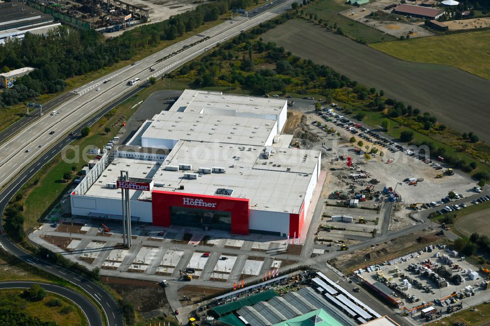 Aerial photograph Fredersdorf-Vogelsdorf - Revitalization and expansion construction site at the building complex Moebel Hoeffner as part of the shopping center Multicenter Vogelsdorf on Frankfurter Chaussee in Fredersdorf-Vogelsdorf in the federal state of Brandenburg, Germany