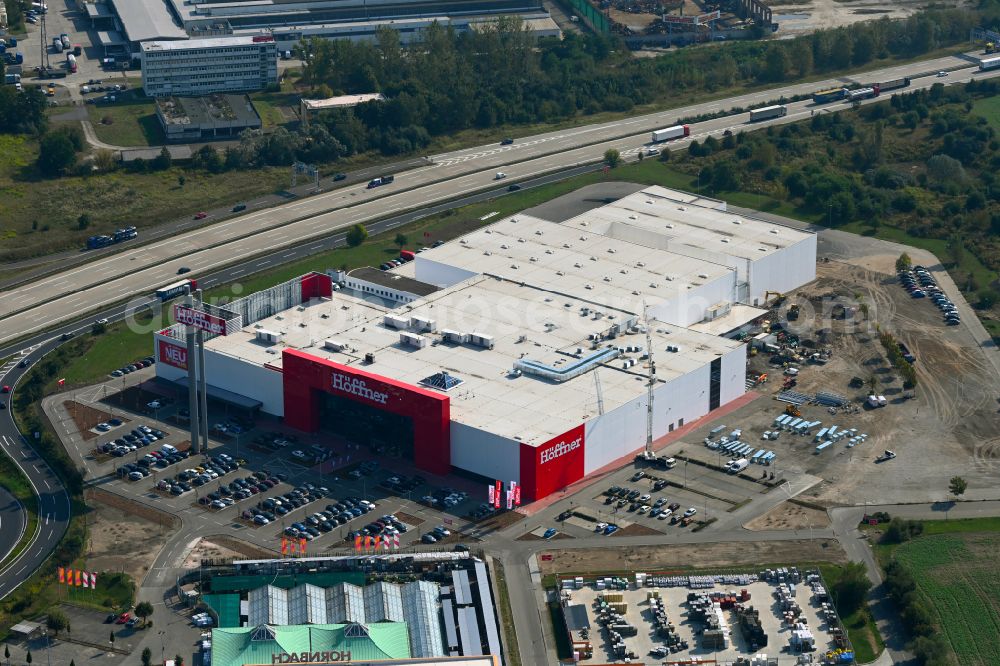 Fredersdorf-Vogelsdorf from the bird's eye view: Revitalization and expansion construction site at the building complex Moebel Hoeffner as part of the shopping center Multicenter Vogelsdorf on Frankfurter Chaussee in Fredersdorf-Vogelsdorf in the federal state of Brandenburg, Germany