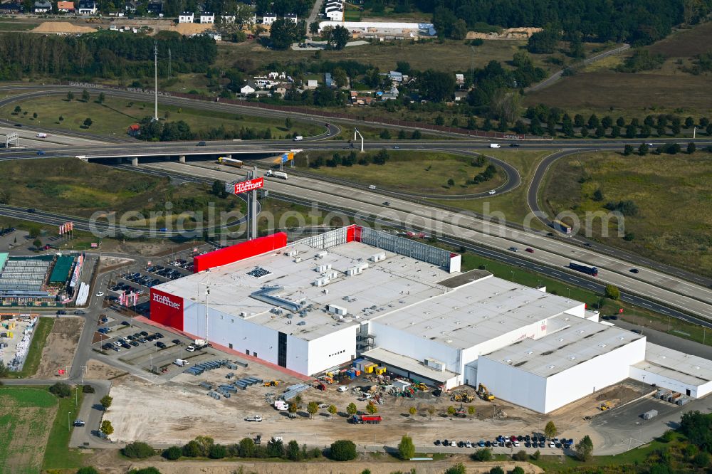 Aerial photograph Fredersdorf-Vogelsdorf - Revitalization and expansion construction site at the building complex Moebel Hoeffner as part of the shopping center Multicenter Vogelsdorf on Frankfurter Chaussee in Fredersdorf-Vogelsdorf in the federal state of Brandenburg, Germany