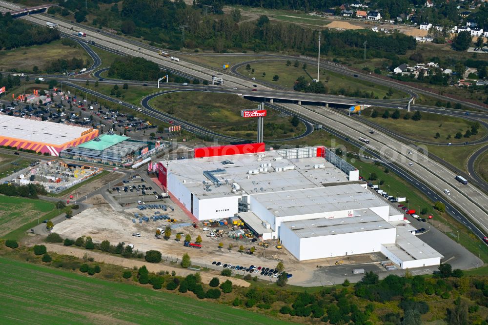 Fredersdorf-Vogelsdorf from above - Revitalization and expansion construction site at the building complex Moebel Hoeffner as part of the shopping center Multicenter Vogelsdorf on Frankfurter Chaussee in Fredersdorf-Vogelsdorf in the federal state of Brandenburg, Germany