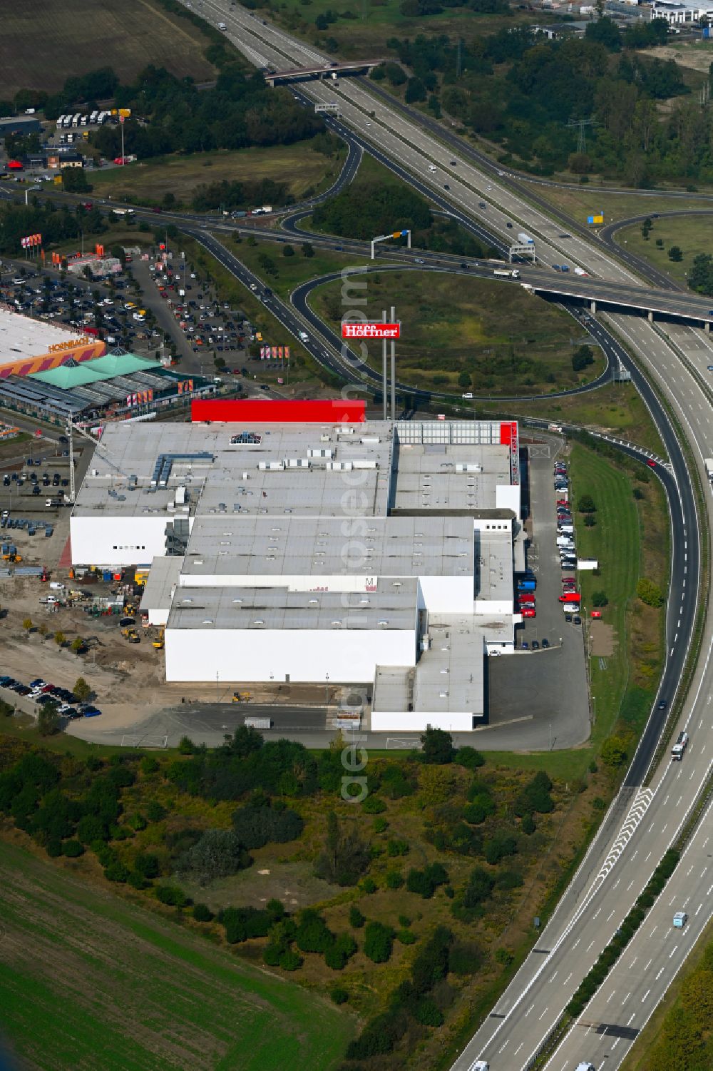 Fredersdorf-Vogelsdorf from the bird's eye view: Revitalization and expansion construction site at the building complex Moebel Hoeffner as part of the shopping center Multicenter Vogelsdorf on Frankfurter Chaussee in Fredersdorf-Vogelsdorf in the federal state of Brandenburg, Germany