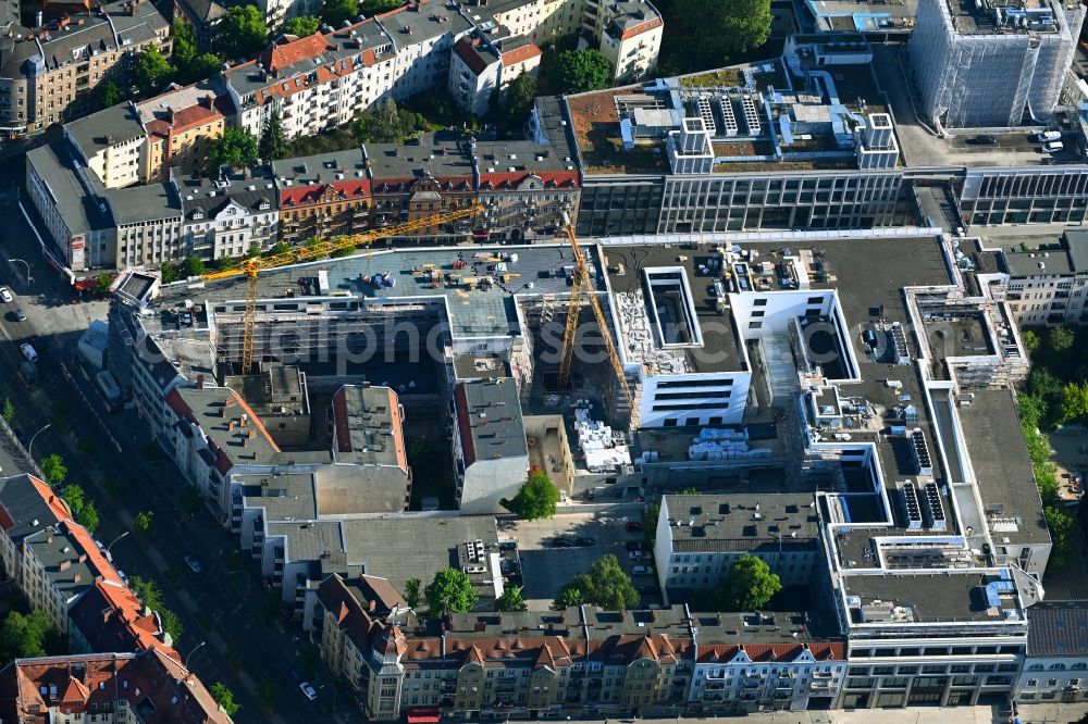 Aerial photograph Berlin - Revitalization and expansion construction at the building complex of the shopping center Tegel Quartier on street Gorkistrasse in the district Tegel in Berlin, Germany