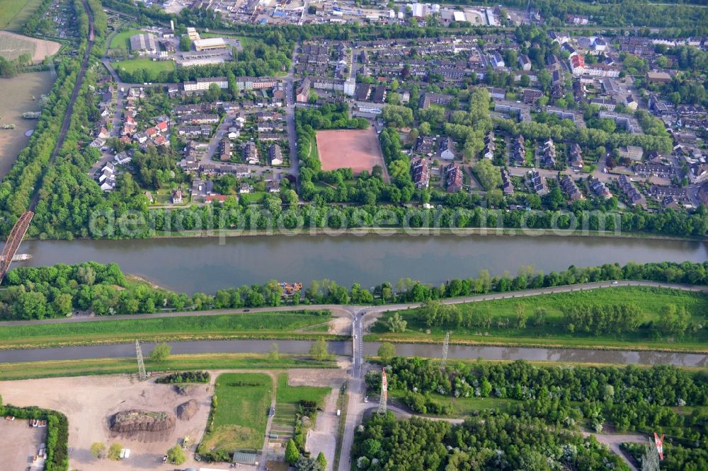 Essen from the bird's eye view: View from north to south across the Rhine-Herne Canal with a railway bridge in Oberhausen in North Rhine-Westphalia