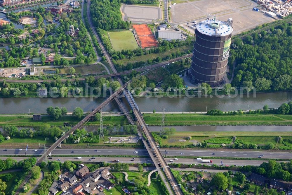 Oberhausen from above - View from north to south across the Rhine-Herne Canal at the Gasometer with railway bridges and a foot- and bisycle bridge in Oberhausen in North Rhine-Westphalia