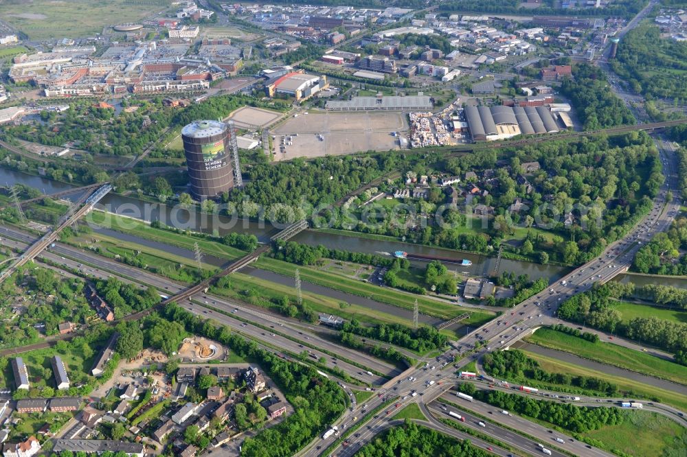 Oberhausen from the bird's eye view: View from north to south across the Rhine-Herne Canal with bridges and the Gasometer in Oberhausen in North Rhine-Westphalia