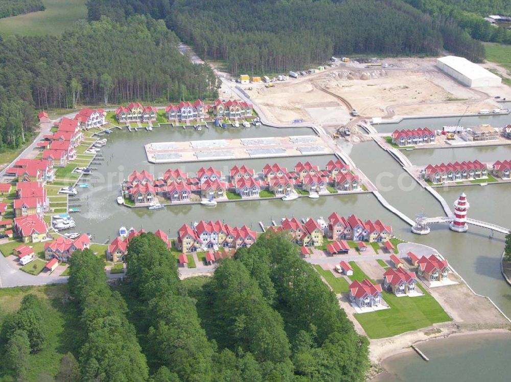 Rheinsberg from the bird's eye view: Rheinsberg / Brandenburg Blick auf das fast fertige Hafendorf Rheinsberg - Projektgesellschaft Hafendorf Rheinsberg GmbH,Lenaustr. 27,D-12305 Berlin,Telefon: +49 33931/34 161,Telefax: +49 33931/34 163,Email: info@hafendorf-rheinsberg.de,Achim Walder: