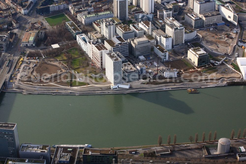 Aerial photograph Basel - The banks of the river Rhine at the buildings and production halls on the factory premises of pharmaceutical company Novartis in Basel, Switzerland, will be made available to the public. So far, the plants of the Rhine harbor St. Johann have prevented the passage of the Rhine promenade