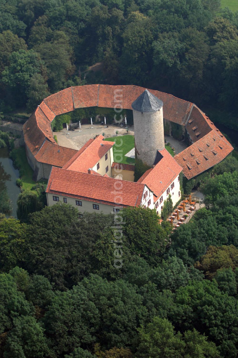 Aerial photograph Dedeleben-Westerburg - Blick auf die seit Juni 2000 als Hotel umgebaute Westerburg. Sie ist die älteste und besterhaltene Wasserburg Deutschlands und Teil der Strasse der Romanik. Telefon: 0(49)39422-955-0; Fax: 0(49)39422-955-66; e-mail: lerche@hotel-westerburg.de Dedeleben-Westerburg 2007/08/07 This building is the oldest well-preserved moated castle in Germany. In June 2000 the Westerburg was altered into a hotel. It is part of the Strasse der Romanik.