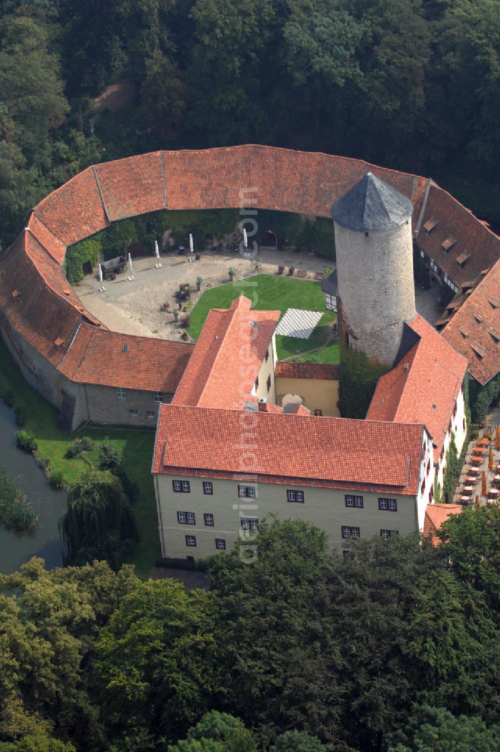 Dedeleben-Westerburg from the bird's eye view: Blick auf die seit Juni 2000 als Hotel umgebaute Westerburg. Sie ist die älteste und besterhaltene Wasserburg Deutschlands und Teil der Strasse der Romanik. Telefon: 0(49)39422-955-0; Fax: 0(49)39422-955-66; e-mail: lerche@hotel-westerburg.de Dedeleben-Westerburg 2007/08/07 This building is the oldest well-preserved moated castle in Germany. In June 2000 the Westerburg was altered into a hotel. It is part of the Strasse der Romanik.