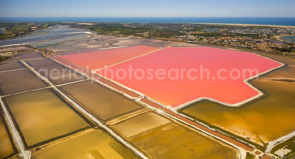 Aerial image Saintes-Maries-de-la-Mer - Colored Salinen- landscape in Saintes-Maries-de-la-Mer in France