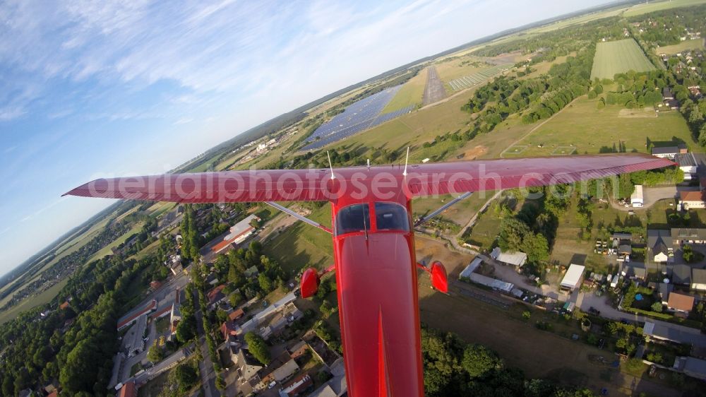 Aerial photograph Werneuchen - Read colored Light aircraft Cessna 172 D-EGYC Agency euroluftbild.de on runway 08 of airfield in Werneuchen in the state Brandenburg